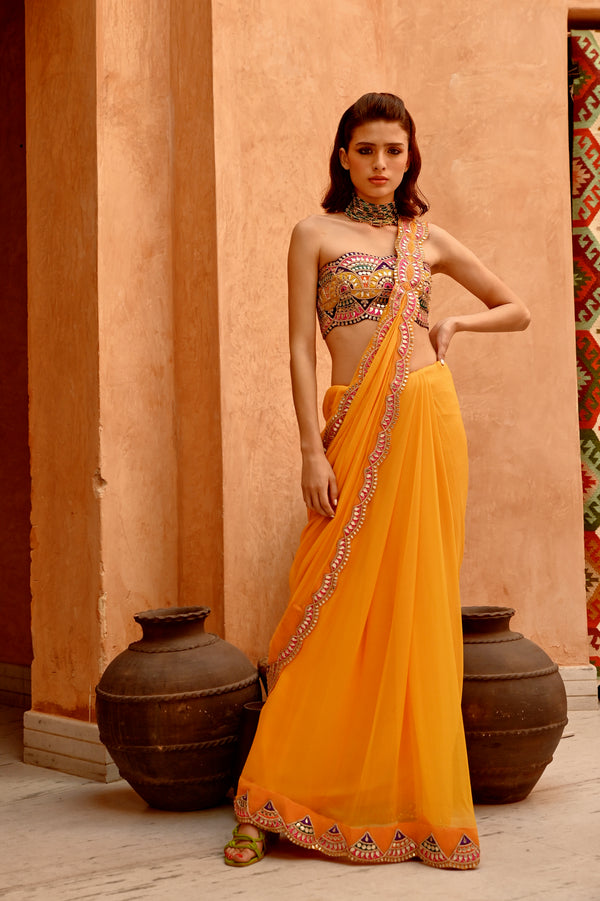 Mango yellow saree with pre-stitched palla and pleats  with bejewelled bandeau blouse