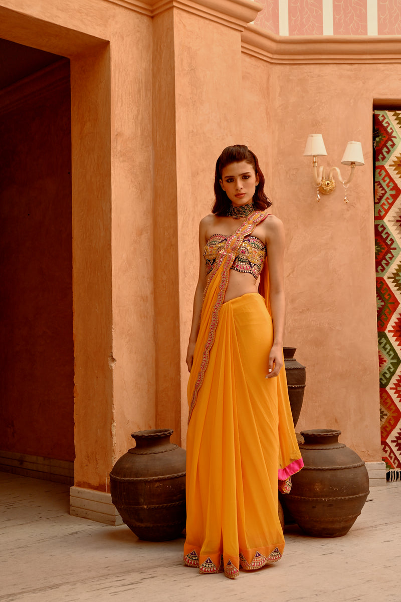 Mango yellow saree with pre-stitched palla and pleats  with bejewelled bandeau blouse