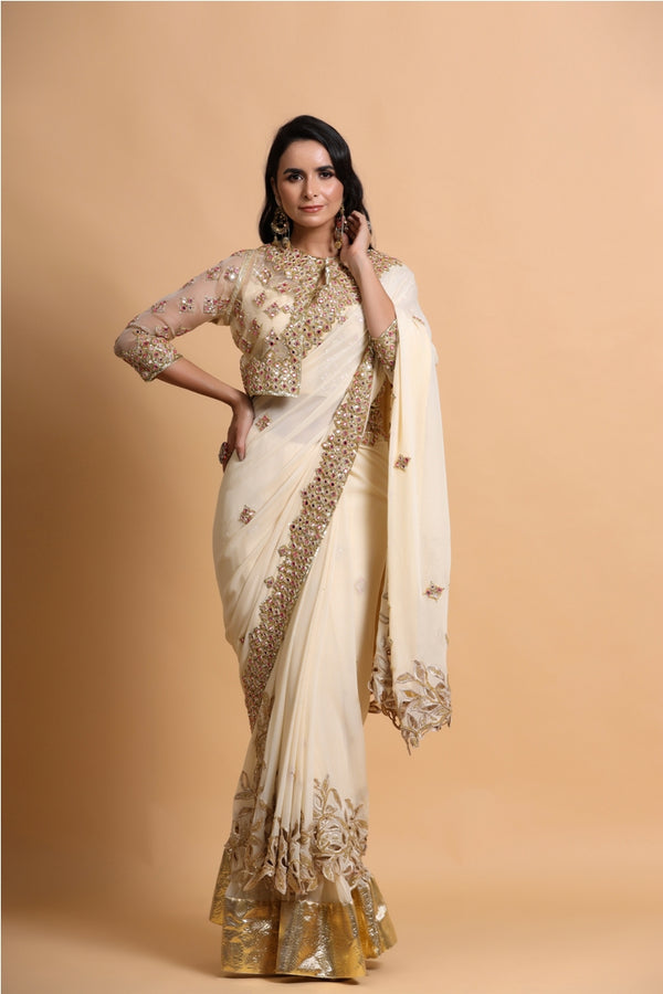 Fawn cutwork saree with strap blouse and jacket