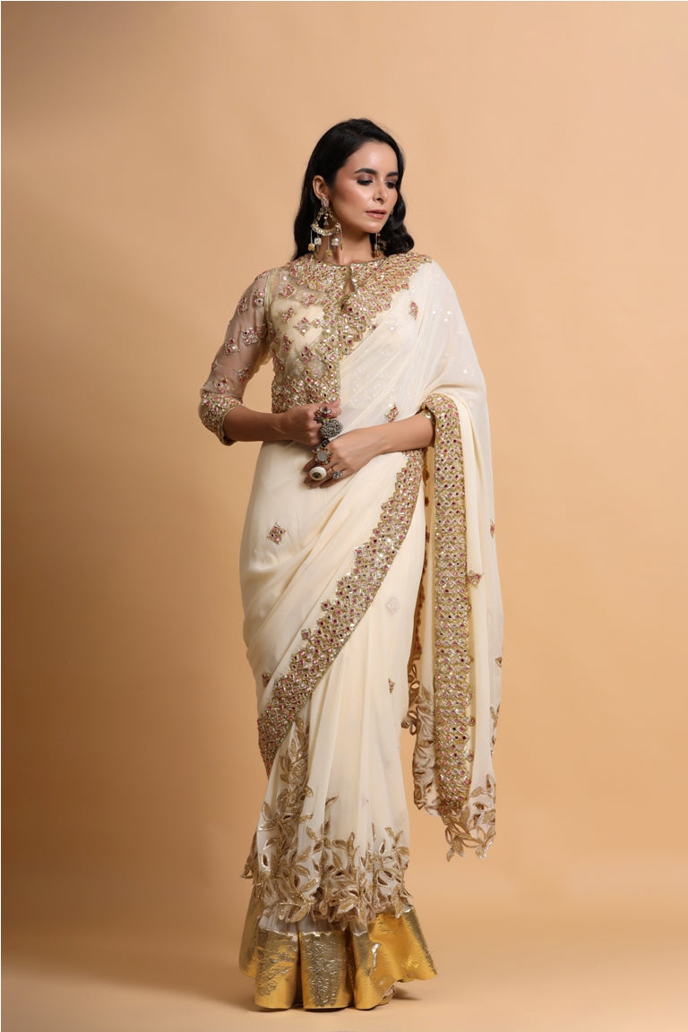 Fawn cutwork saree with strap blouse and jacket