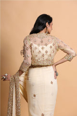 Fawn cutwork saree with strap blouse and jacket
