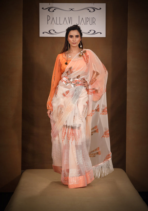 Rangeen Almond Peach fringe saree with Aakarshak blouse Set